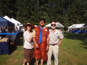 Rice Rock and Mineral Museum Executive Director Julian Gray and Curator Leslie Moclock with Fred Flintstone