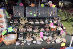 Jewelry and gem trees for sale at vendor booth.