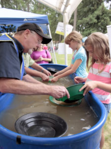Gold panning with rock club members and children.