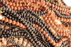 Polished beads on display in vendors booth for necklaces and jewelry.