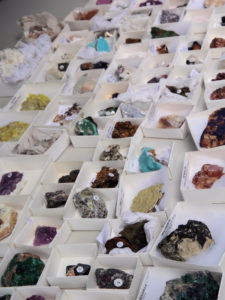 Precious gems and minerals on display in vendor's booth.