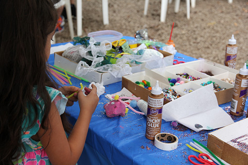 Summer Fest 2015 Young Girl decorates rocks in Kids Corner at the Rice Northwest Museum.